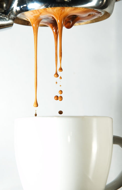 coffee dripping into a cup